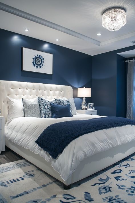 Blue-toned bedroom with layered lighting