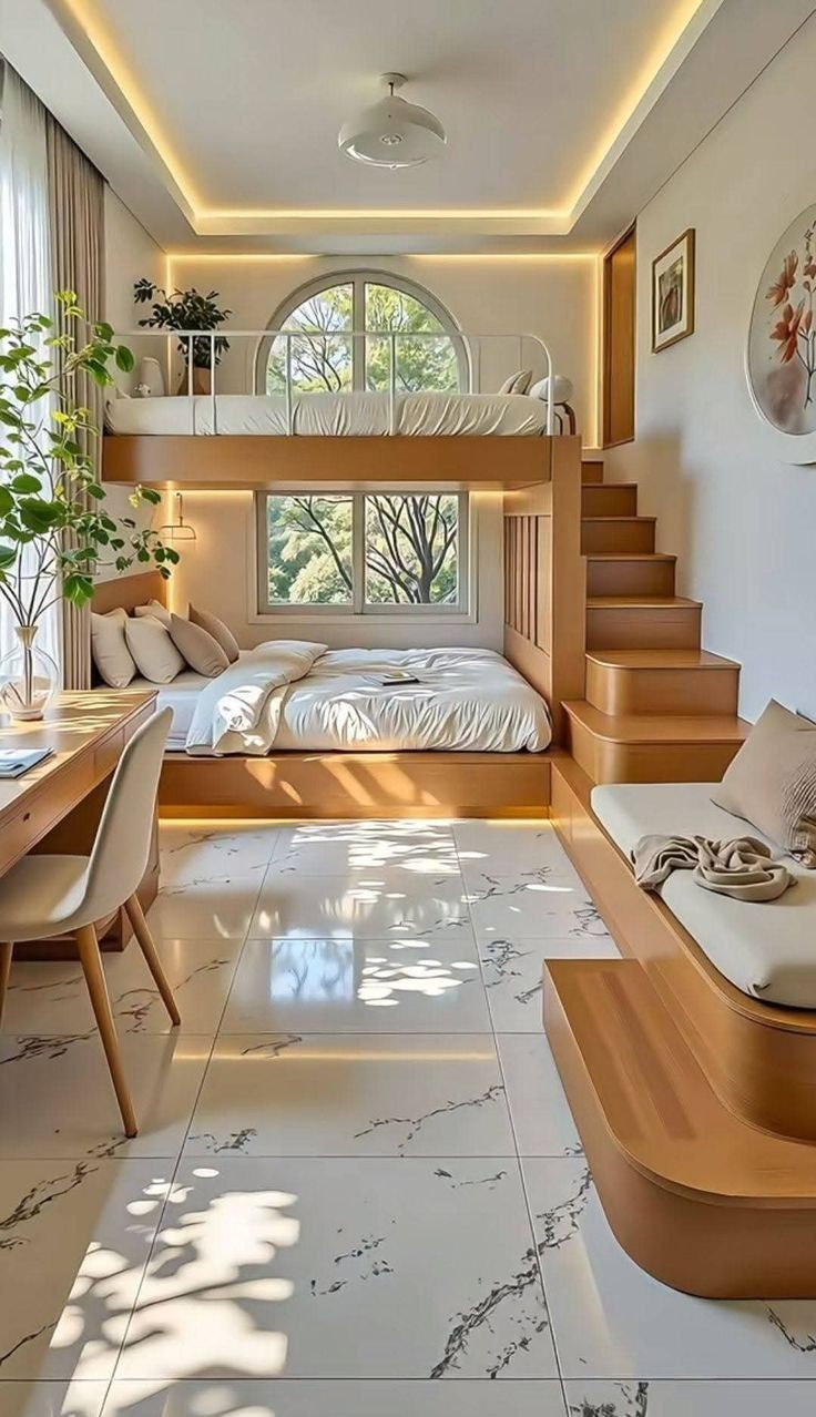 Loft sleeping platform with built-in stairs and warm cove lighting