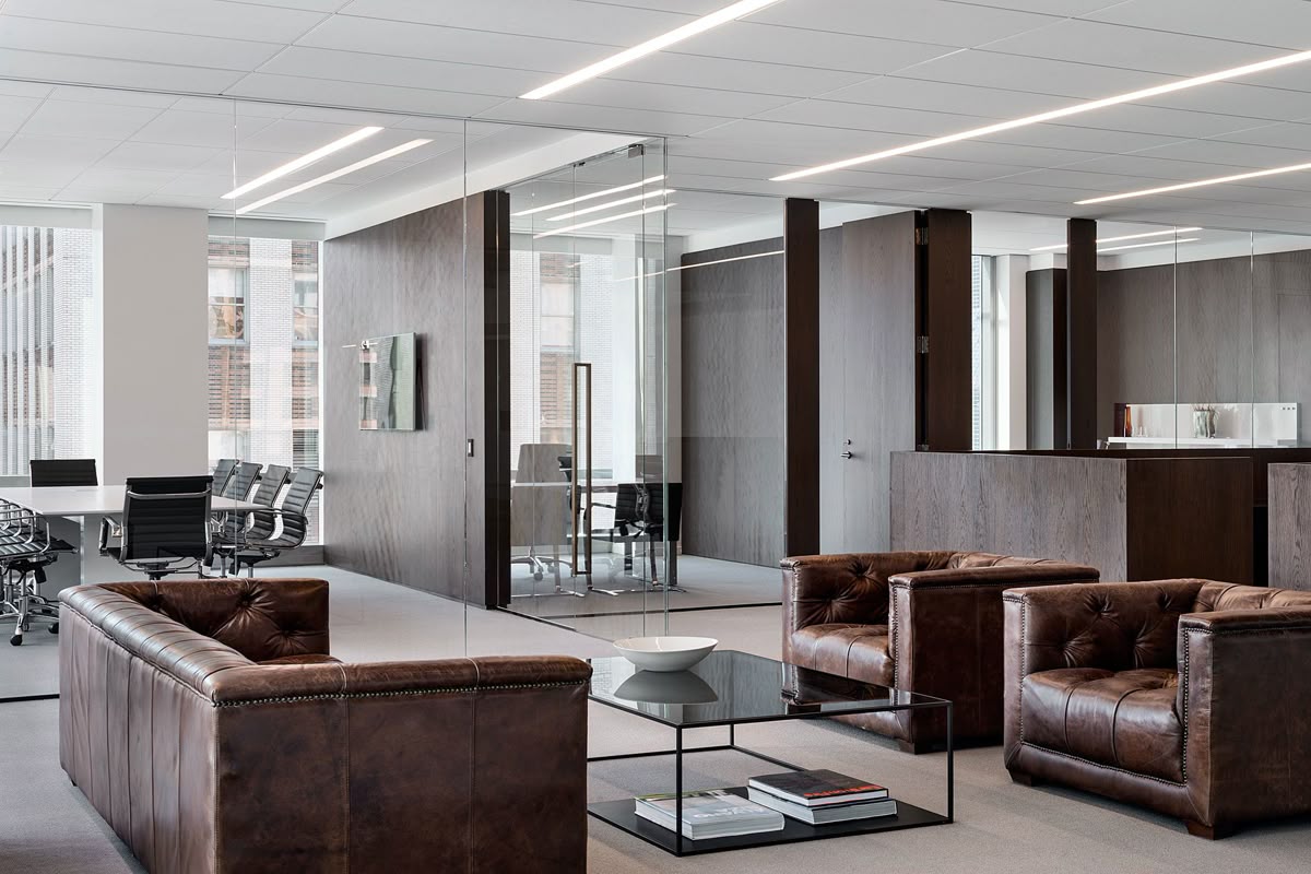 Refined office lounge and meeting space by Drishya Design
